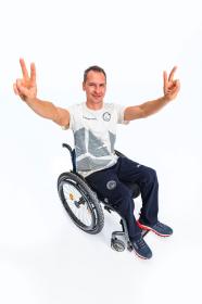 Alpine Pro CAMPION pánské triko z olympijské kolekce zoh 2026 NEUTRÁLNÍ / ZEMITÁ