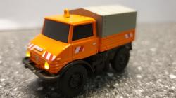 Carson RC auto MB Unimog U406 1:87 oranžová