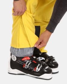 KILPI RHEA-M Žluté pánské softshellové lyžařské kalhoty